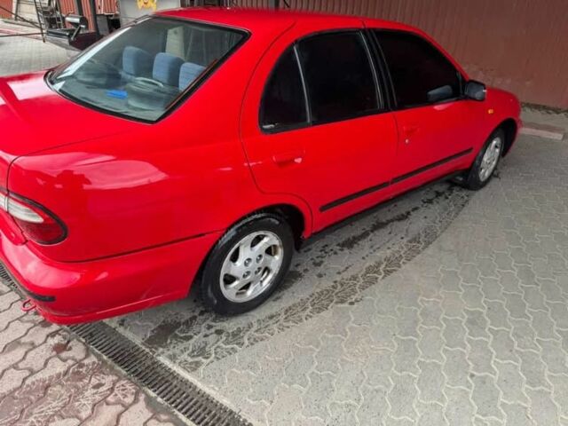 Червоний Ніссан Альмера, об'ємом двигуна 1.4 л та пробігом 250 тис. км за 1500 $, фото 7 на Automoto.ua