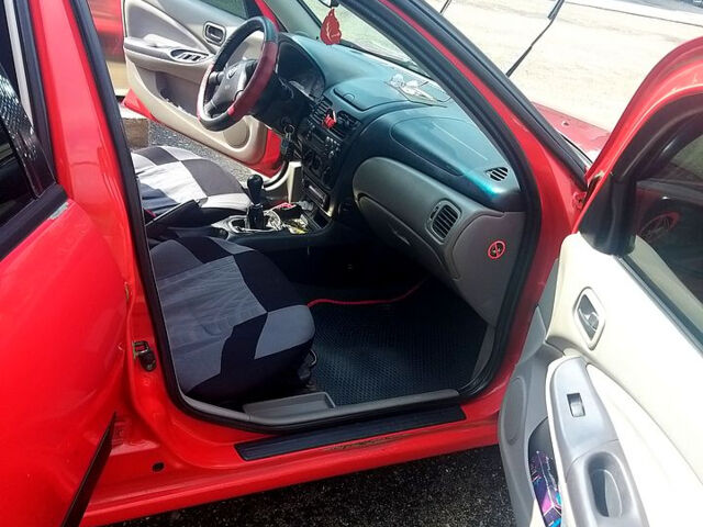 Червоний Ніссан Альмера, об'ємом двигуна 1.5 л та пробігом 0 тис. км за 2700 $, фото 7 на Automoto.ua