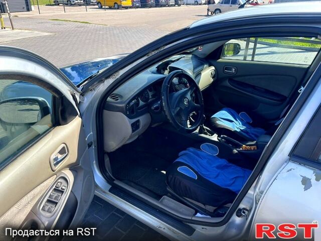 Серый Ниссан Альмера, объемом двигателя 2.2 л и пробегом 371 тыс. км за 1080 $, фото 6 на Automoto.ua