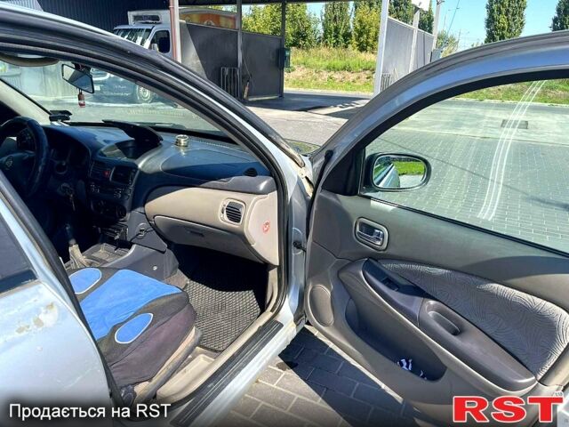 Серый Ниссан Альмера, объемом двигателя 2.2 л и пробегом 371 тыс. км за 1080 $, фото 4 на Automoto.ua