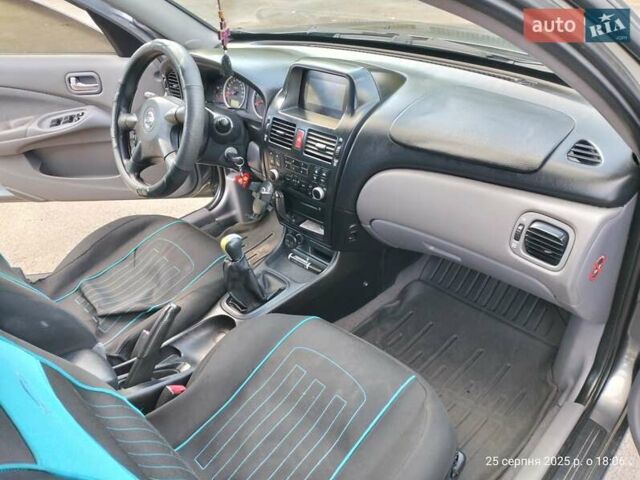 Серый Ниссан Альмера, объемом двигателя 1.5 л и пробегом 247 тыс. км за 3900 $, фото 7 на Automoto.ua
