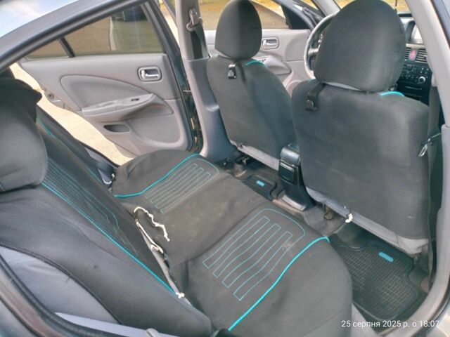 Серый Ниссан Альмера, объемом двигателя 1.5 л и пробегом 247 тыс. км за 3200 $, фото 7 на Automoto.ua