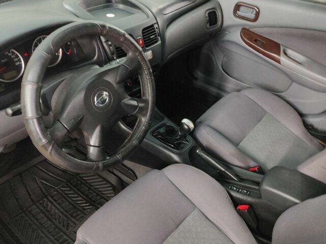 Серый Ниссан Альмера, объемом двигателя 1.5 л и пробегом 350 тыс. км за 2800 $, фото 6 на Automoto.ua