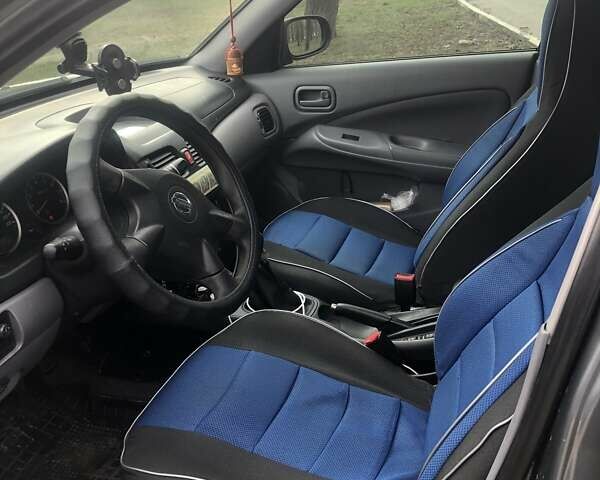 Сірий Ніссан Альмера, об'ємом двигуна 1.5 л та пробігом 245 тис. км за 4500 $, фото 6 на Automoto.ua