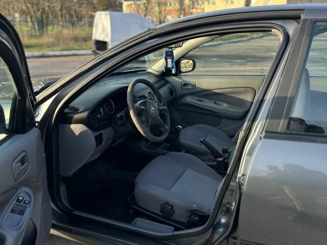 Серый Ниссан Альмера, объемом двигателя 1.5 л и пробегом 300 тыс. км за 2999 $, фото 13 на Automoto.ua