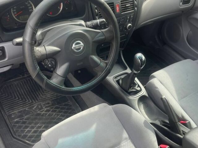 Серый Ниссан Альмера, объемом двигателя 1.5 л и пробегом 300 тыс. км за 3700 $, фото 7 на Automoto.ua