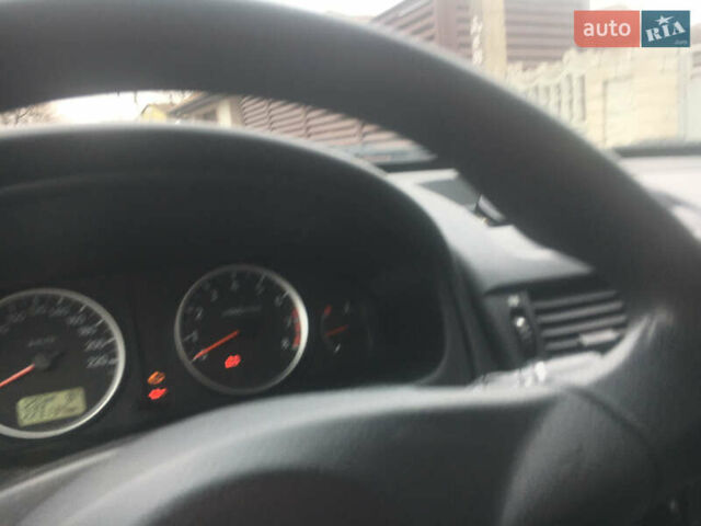 Серый Ниссан Альмера, объемом двигателя 1.5 л и пробегом 245 тыс. км за 3800 $, фото 4 на Automoto.ua