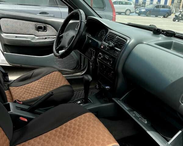 Сірий Ніссан Альмера, об'ємом двигуна 1.6 л та пробігом 393 тис. км за 1600 $, фото 12 на Automoto.ua
