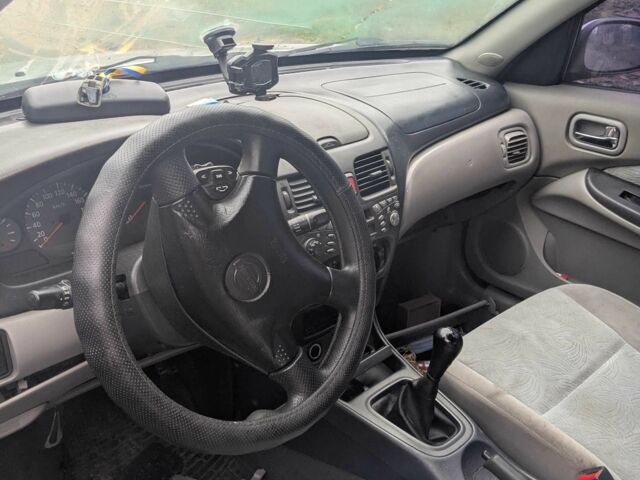 Сірий Ніссан Альмера, об'ємом двигуна 2.2 л та пробігом 470 тис. км за 1500 $, фото 4 на Automoto.ua