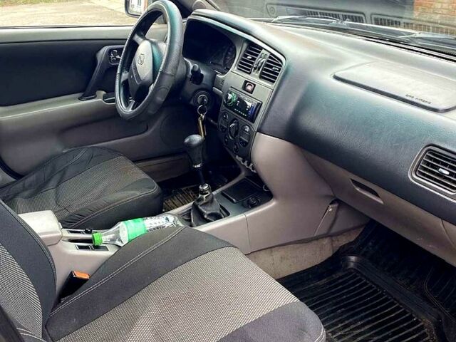 Серый Ниссан Альмера, объемом двигателя 2 л и пробегом 205 тыс. км за 2290 $, фото 6 на Automoto.ua