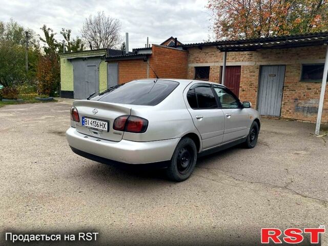 Серый Ниссан Альмера, объемом двигателя 2 л и пробегом 205 тыс. км за 2290 $, фото 2 на Automoto.ua