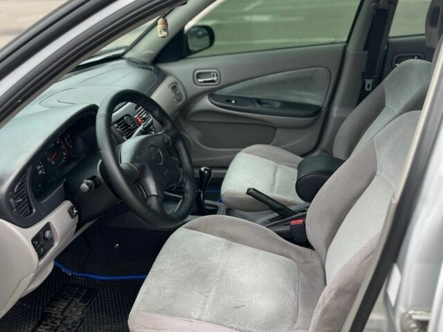 Серый Ниссан Альмера, объемом двигателя 1.8 л и пробегом 350 тыс. км за 2600 $, фото 7 на Automoto.ua