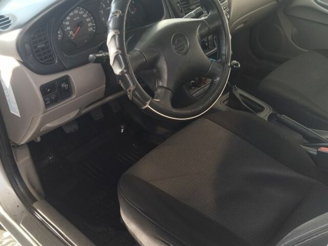 Серый Ниссан Альмера, объемом двигателя 1.5 л и пробегом 351 тыс. км за 3800 $, фото 5 на Automoto.ua