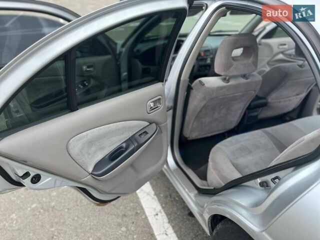 Серый Ниссан Альмера, объемом двигателя 1.8 л и пробегом 372 тыс. км за 2600 $, фото 13 на Automoto.ua