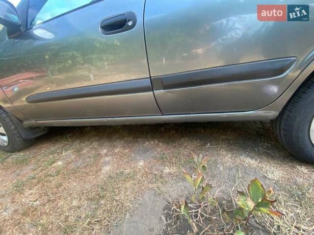 Серый Ниссан Альмера, объемом двигателя 1.5 л и пробегом 227 тыс. км за 2800 $, фото 4 на Automoto.ua