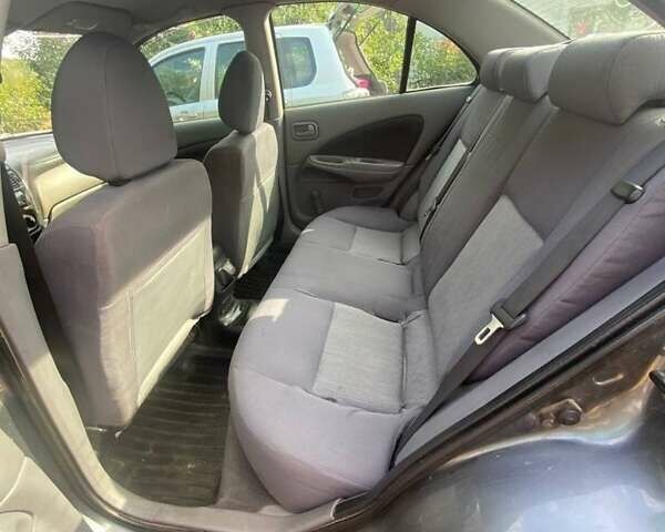 Серый Ниссан Альмера, объемом двигателя 1.5 л и пробегом 227 тыс. км за 2800 $, фото 5 на Automoto.ua