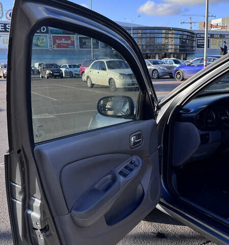 Серый Ниссан Альмера, объемом двигателя 1.8 л и пробегом 181 тыс. км за 4400 $, фото 9 на Automoto.ua