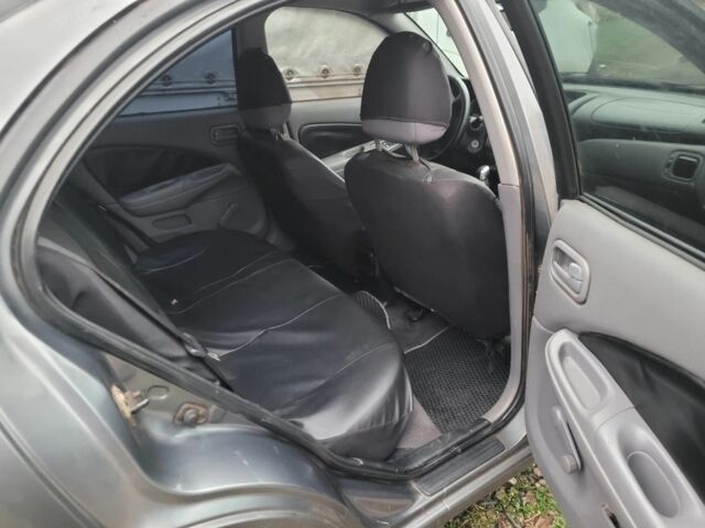 Серый Ниссан Альмера, объемом двигателя 1.5 л и пробегом 380 тыс. км за 3000 $, фото 2 на Automoto.ua