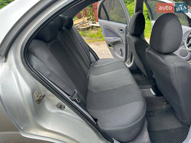Серый Ниссан Альмера, объемом двигателя 1.5 л и пробегом 302 тыс. км за 2500 $, фото 11 на Automoto.ua