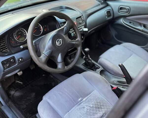 Сірий Ніссан Альмера, об'ємом двигуна 1.5 л та пробігом 352 тис. км за 3600 $, фото 11 на Automoto.ua
