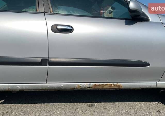 Серый Ниссан Альмера, объемом двигателя 1.77 л и пробегом 300 тыс. км за 3132 $, фото 1 на Automoto.ua