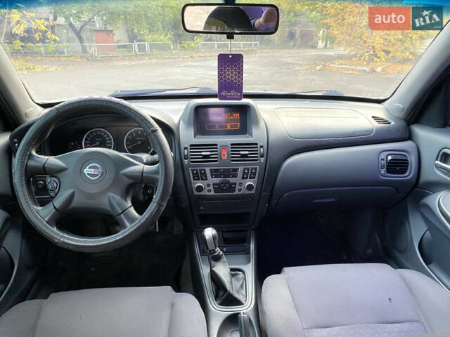 Сірий Ніссан Альмера, об'ємом двигуна 1.5 л та пробігом 299 тис. км за 2850 $, фото 6 на Automoto.ua