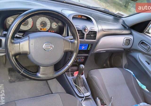 Сірий Ніссан Альмера, об'ємом двигуна 1.6 л та пробігом 136 тис. км за 4999 $, фото 7 на Automoto.ua