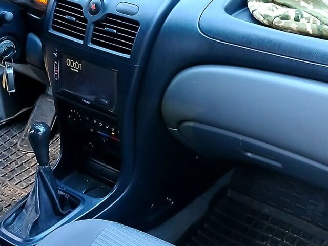 Серый Ниссан Альмера, объемом двигателя 1.6 л и пробегом 212 тыс. км за 4500 $, фото 3 на Automoto.ua