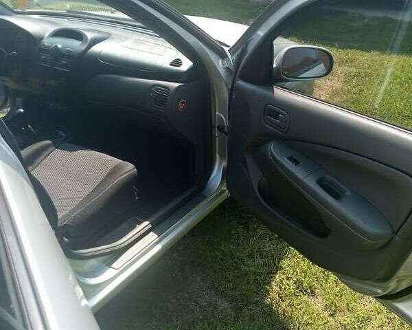 Сірий Ніссан Альмера, об'ємом двигуна 1.6 л та пробігом 263 тис. км за 4600 $, фото 4 на Automoto.ua