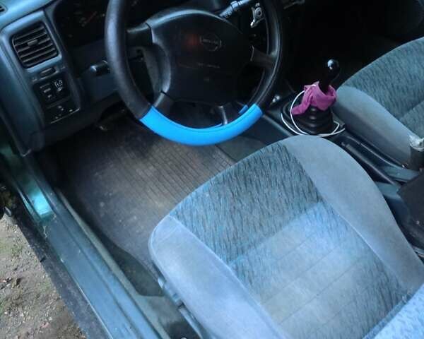 Синий Ниссан Альмера, объемом двигателя 1.4 л и пробегом 210 тыс. км за 1650 $, фото 1 на Automoto.ua