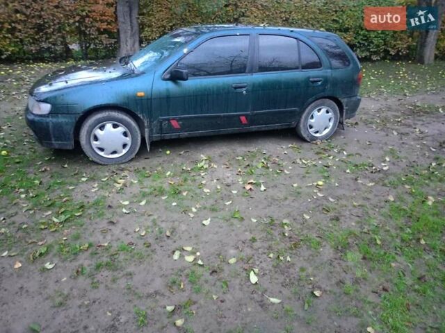 Синий Ниссан Альмера, объемом двигателя 1.4 л и пробегом 210 тыс. км за 1650 $, фото 2 на Automoto.ua