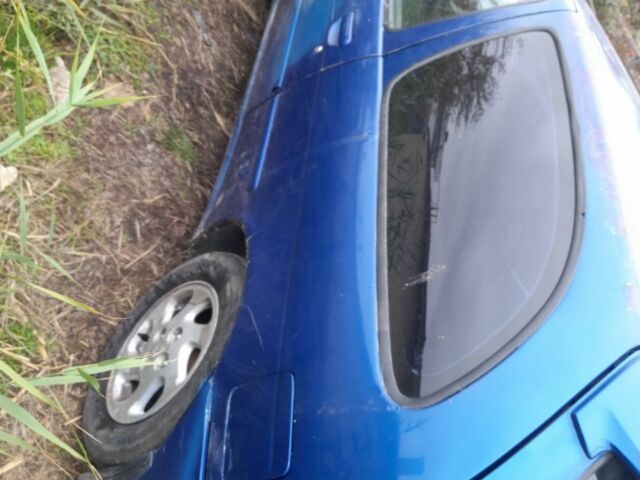 Синій Ніссан Альмера, об'ємом двигуна 1 л та пробігом 300 тис. км за 1350 $, фото 2 на Automoto.ua