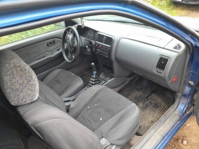 Синій Ніссан Альмера, об'ємом двигуна 1 л та пробігом 300 тис. км за 1350 $, фото 4 на Automoto.ua