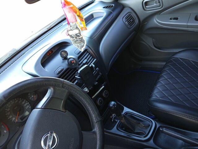 Синий Ниссан Альмера, объемом двигателя 1.6 л и пробегом 265 тыс. км за 4000 $, фото 6 на Automoto.ua