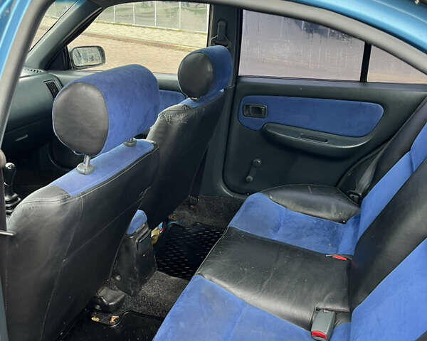 Синий Ниссан Альмера, объемом двигателя 1.4 л и пробегом 155 тыс. км за 1950 $, фото 11 на Automoto.ua