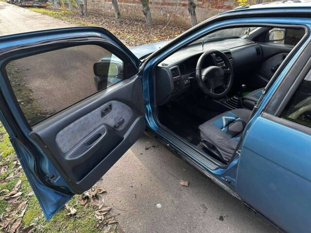 Синій Ніссан Альмера, об'ємом двигуна 1.4 л та пробігом 200 тис. км за 1700 $, фото 9 на Automoto.ua