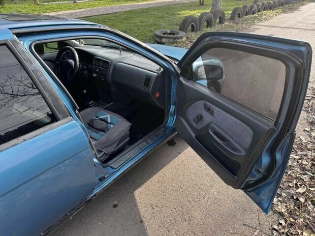 Синій Ніссан Альмера, об'ємом двигуна 1.4 л та пробігом 200 тис. км за 1700 $, фото 11 на Automoto.ua