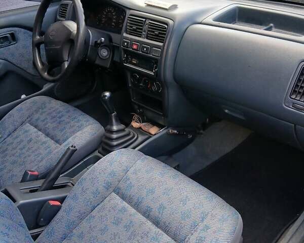 Синій Ніссан Альмера, об'ємом двигуна 1.4 л та пробігом 295 тис. км за 2650 $, фото 4 на Automoto.ua