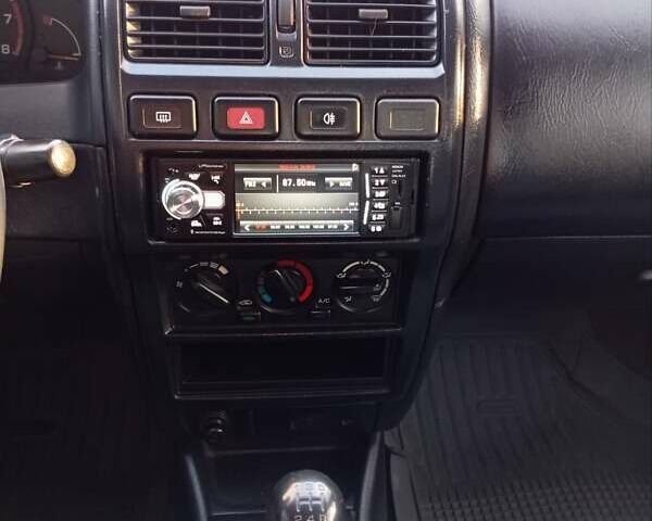 Синий Ниссан Альмера, объемом двигателя 1.4 л и пробегом 263 тыс. км за 1900 $, фото 13 на Automoto.ua