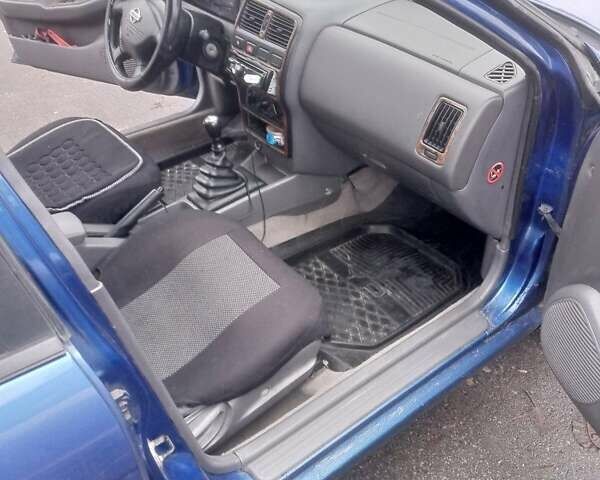 Синій Ніссан Альмера, об'ємом двигуна 1.4 л та пробігом 323 тис. км за 1800 $, фото 5 на Automoto.ua