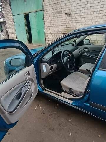 Синій Ніссан Альмера, об'ємом двигуна 1.5 л та пробігом 300 тис. км за 2900 $, фото 5 на Automoto.ua