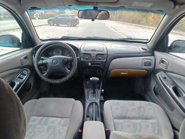 Синий Ниссан Альмера, объемом двигателя 1.6 л и пробегом 241 тыс. км за 3000 $, фото 9 на Automoto.ua