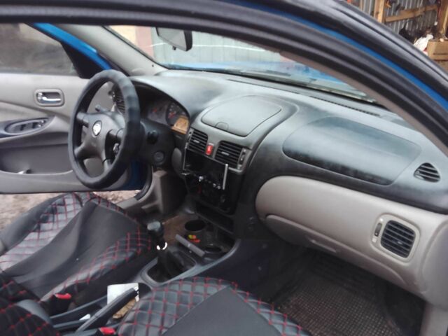 Синій Ніссан Альмера, об'ємом двигуна 1.4 л та пробігом 158 тис. км за 3500 $, фото 9 на Automoto.ua