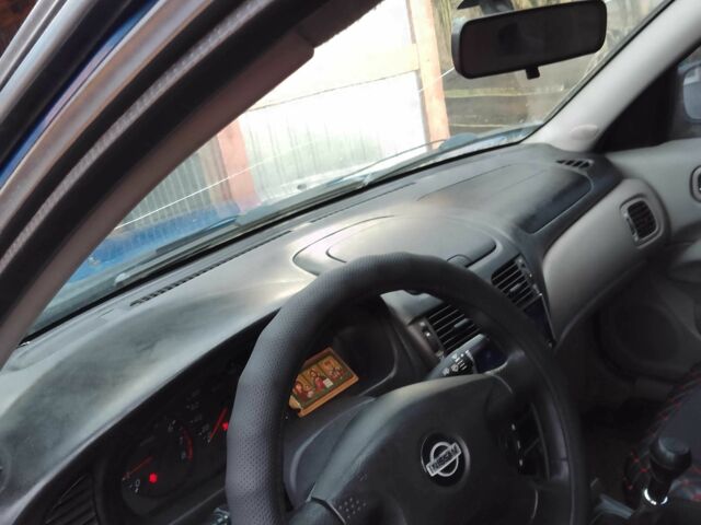 Синій Ніссан Альмера, об'ємом двигуна 1.4 л та пробігом 158 тис. км за 3500 $, фото 6 на Automoto.ua