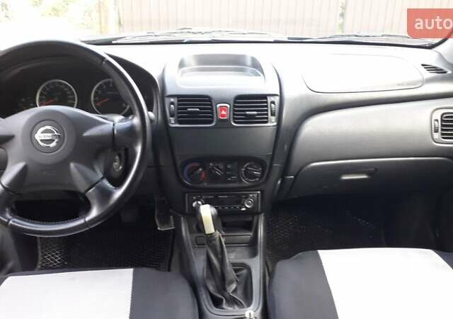 Синий Ниссан Альмера, объемом двигателя 1.5 л и пробегом 319 тыс. км за 3500 $, фото 11 на Automoto.ua