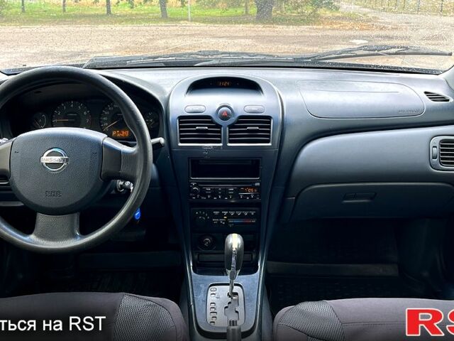 Синий Ниссан Альмера, объемом двигателя 1.6 л и пробегом 324 тыс. км за 4500 $, фото 6 на Automoto.ua