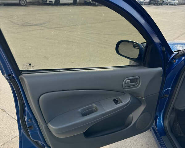 Синій Ніссан Альмера, об'ємом двигуна 1.6 л та пробігом 200 тис. км за 3899 $, фото 12 на Automoto.ua