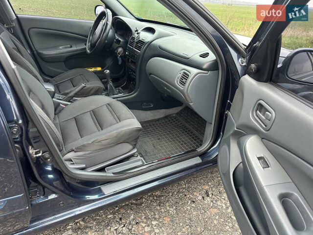 Синий Ниссан Альмера, объемом двигателя 1.6 л и пробегом 236 тыс. км за 5000 $, фото 29 на Automoto.ua