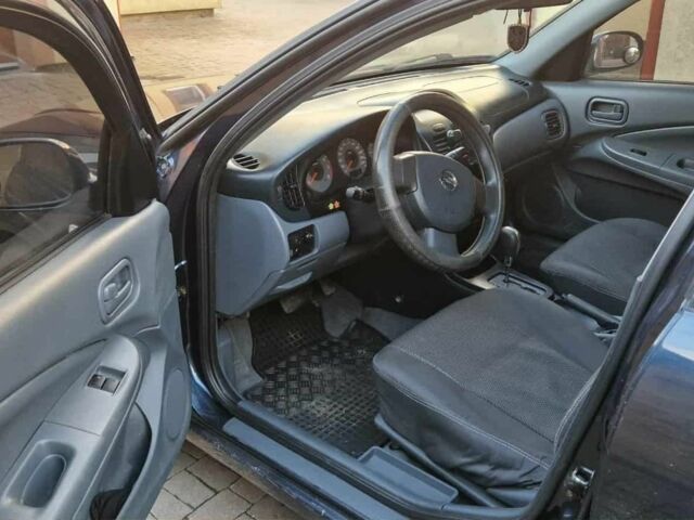 Синій Ніссан Альмера, об'ємом двигуна 1.6 л та пробігом 250 тис. км за 5100 $, фото 6 на Automoto.ua