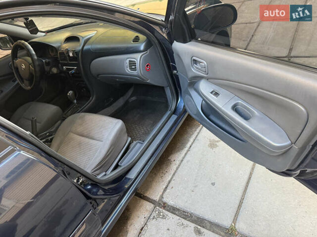 Синий Ниссан Альмера, объемом двигателя 1.6 л и пробегом 160 тыс. км за 5700 $, фото 8 на Automoto.ua